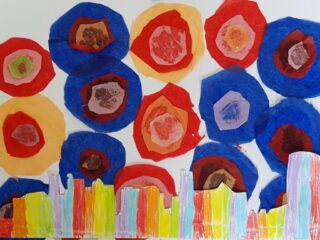 Colourful abstract artwork featuring overlapping circles in blue, red, and yellow hues above a row of multicoloured vertical rectangles, creating a lively, playful scene.