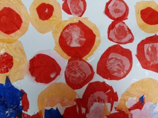 Abstract painting with bold red and yellow circles on a white background. Textured brush strokes create a vibrant, playful, and energetic feel.