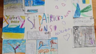 Colourful children's artwork arranged on a paper collage includes drawings of people, hearts, and various shapes. The centre features 