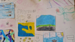 Children's art collage with colourful drawings on a white background. Featured are abstract shapes, landscapes, and doodles, evoking a playful tone.