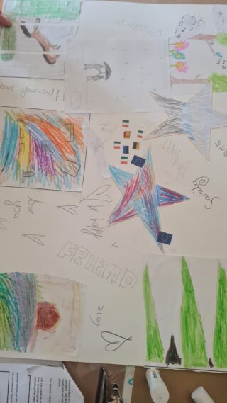 Colourful abstract drawing with star-like shapes, rainbow patterns, and green grass. Features playful elements and varied textures, conveying creativity.