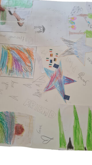 Child's colourful drawing featuring a rainbow, a star with beams, and abstract shapes. The artwork has a playful and imaginative tone.
