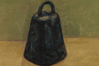 A dark, rustic bell sits on a flat surface against a muted green wall. The bell's texture and shadow suggest heaviness, evoking a sense of calm stillness.