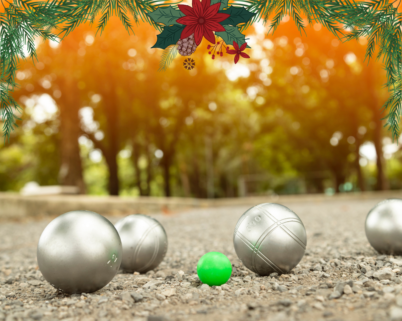 Silver bocce balls and a green target ball are on a gravel path, surrounded by trees. Festive pine and poinsettia decorations frame the scene.