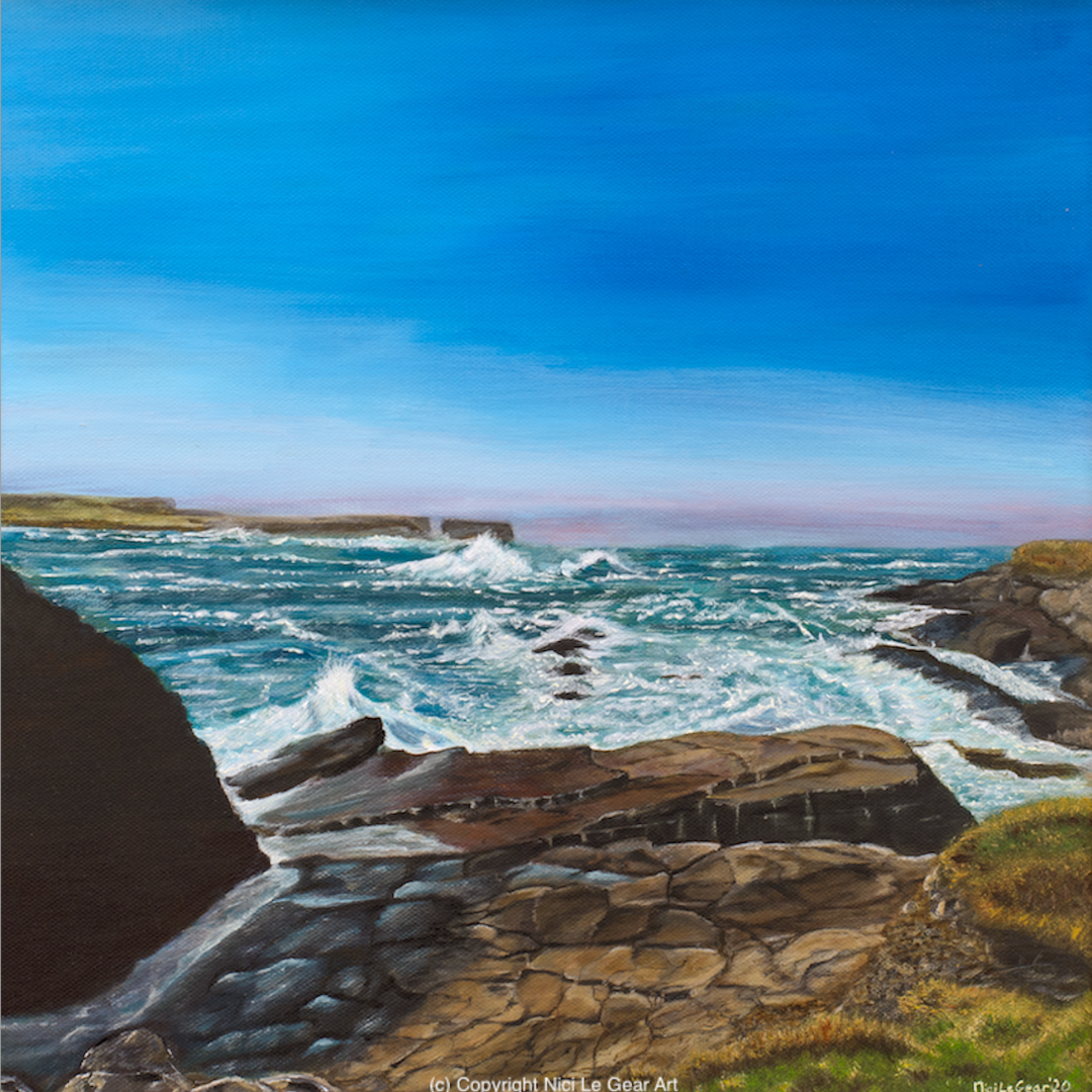 A vibrant seascape painting shows waves crashing against rocky cliffs under a bright blue sky. The scene conveys energy and dynamic movement. Painting of Kilkee by Nici Le Gear