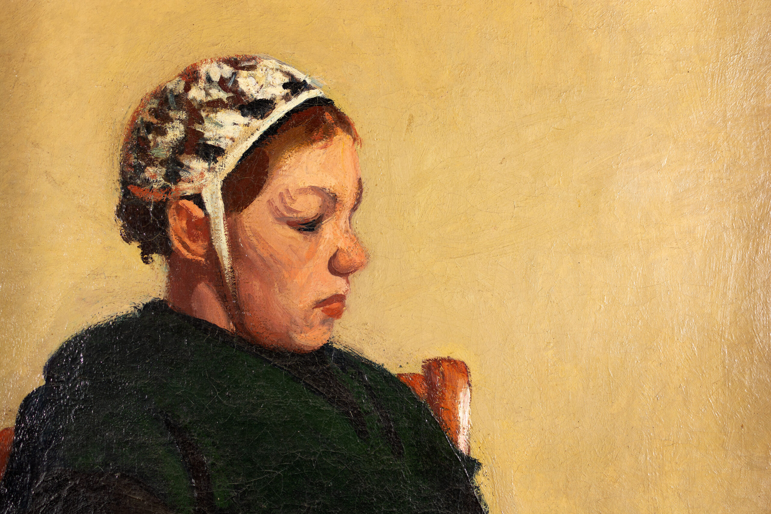 Roderic O'Conor's Breton Women, A seated figure wearing a patterned cap and dark clothing, against a smooth, warm yellow background.